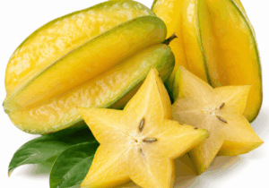 Yellow carambola star fruit with fresh star-shaped slices