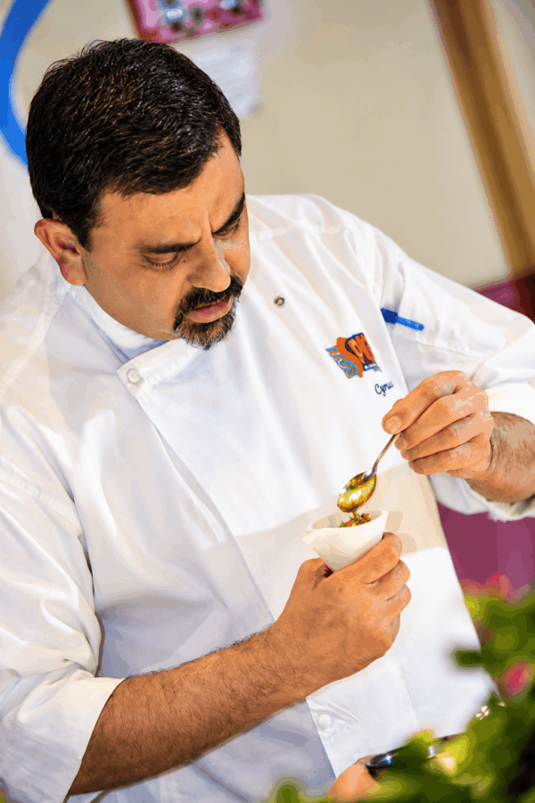 Chef Cyrus Todiwala, a Parsee, was born and brought up in Bombay, where his father was the first Indian employee of the Automobile Association and later became Chief of Road Service, Western India. He was first inspired to become a chef by his mother’s unforgettable cooking. After graduating in Hotel Administration and Food Technology from Bombay’s Basant Kumar Somani Polytechnic, Cyrus quickly made his mark. From a trainee chef, he rose to become Corporate Executive Chef of the famous Taj Group’s Taj Holiday Village, The Fort Aguada Beach Resort and The Aguada Hermitage in Goa. In 1991, after a stint relaunching a restaurant in Poona, he moved with his family to London, where they have remained ever since. Today, Cyrus is known for his refined, elegantly spiced and sophisticated cooking. A popular monthly ‘Khaadraas Club’ (Greedy Gourmand’s Club) takes place every 5–6 weeks at Café Spice Namaste to bring Parsee cooking to a wider audience. Ever the keen environmentalist — he helped to establish two bird sanctuaries in Goa — Cyrus is a champion of sustainability and Buying British. In 2011, Café Spice Namaste received the Sustainable Food Award from the Corporation of London, and Cyrus was named Sustainability Champion by the London Chamber of Commerce and Industry. In the same year, he received the Special Award for Commitment to the Environment and Sustainability from the Footprint Forum. He is an advisor on HRH The Prince of Wales’ Mutton Renaissance Movement and on the London Food Board.