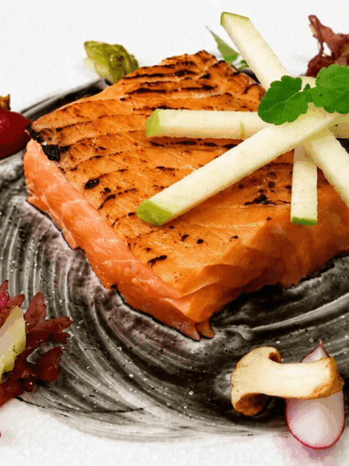 Sea trout confit with ginger soy sauce, pickled vegetables and green apple