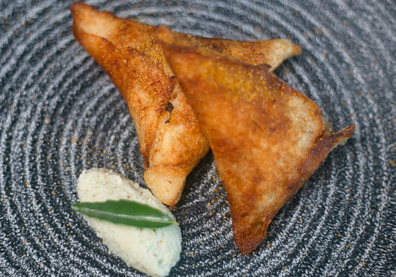 Chicken 65 Dosa Samosa An amazing Indian snack made with left over chicken or chicken 65 dosa samosa served with coconut chutney.