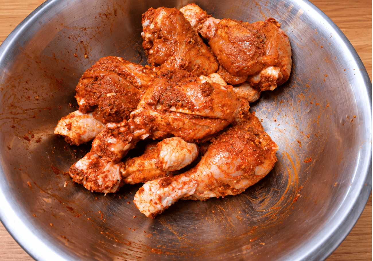 Spice marinated chicken drumsticks for coconut chicken masala