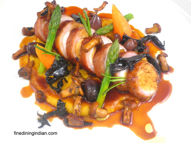 saddle of rabbit,butternut squash puree, black trompets, chanterells and mole sauce