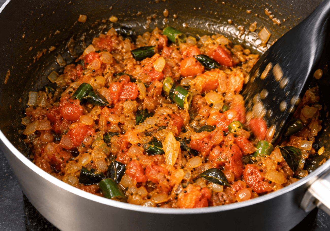 Onion tomato masala with green chilli and curry leaves for semiya upma