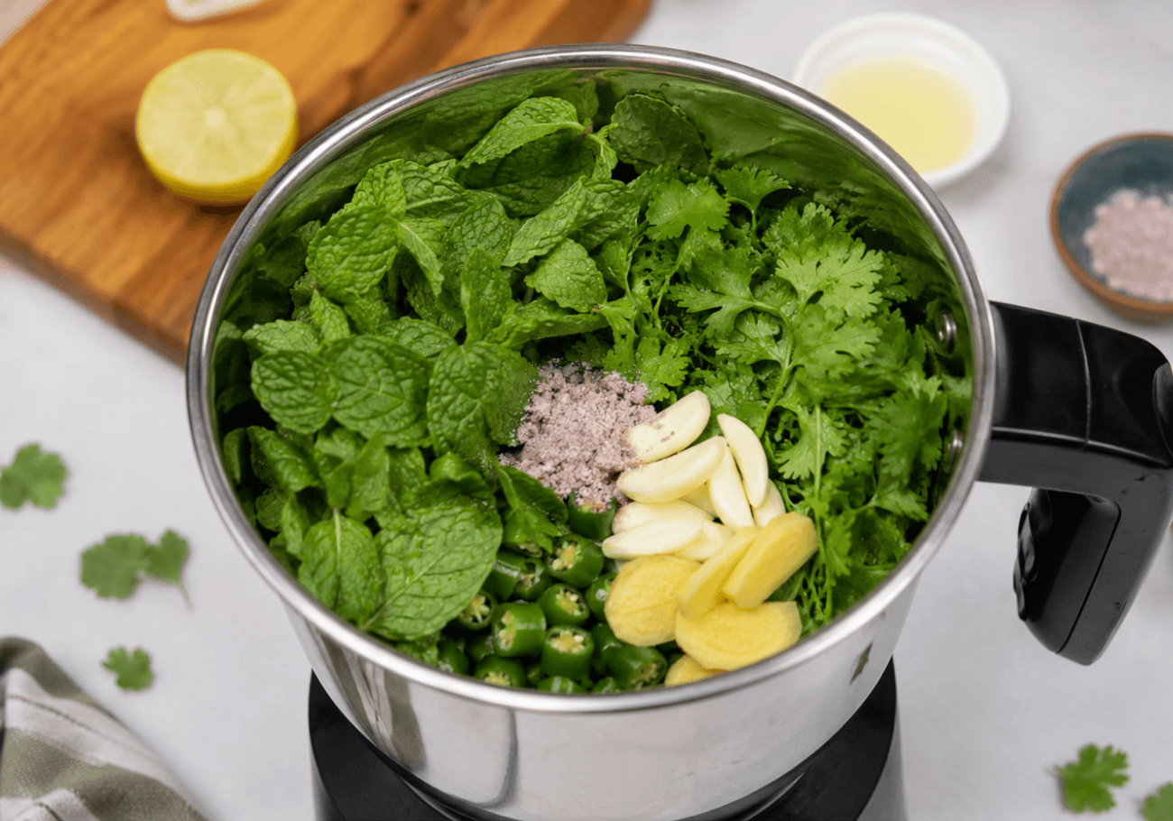 Mint coriander green chilli ginger and garlic in blender for green chutney recipe