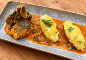 Kerala kappa puzhukku recipe served with seabass fish curry and kokum sauce