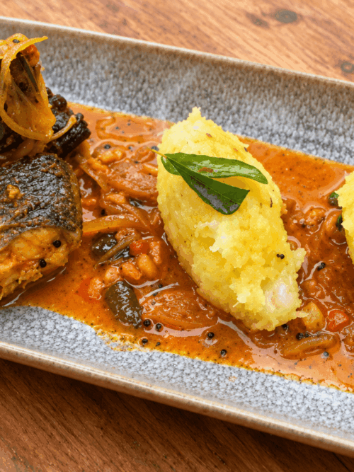Kerala kappa puzhukku recipe served with seabass fish curry and kokum sauce