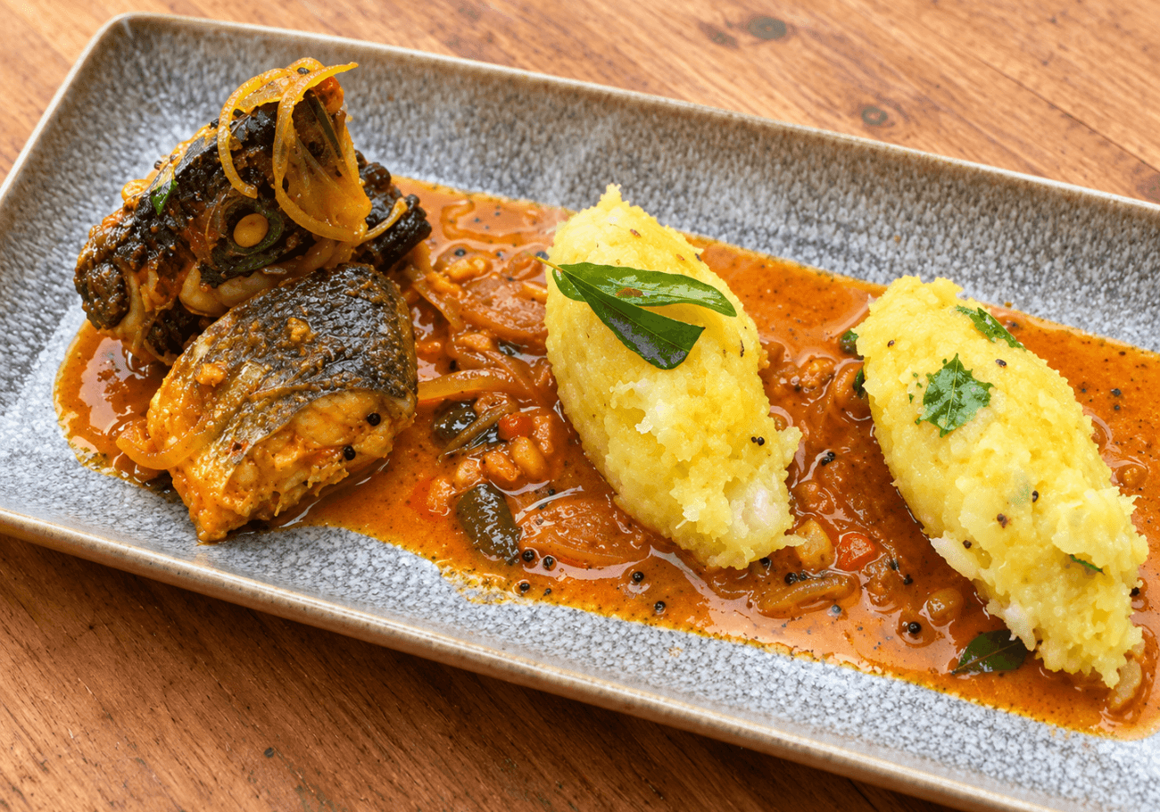 Kerala kappa puzhukku recipe served with seabass fish curry and kokum sauce
