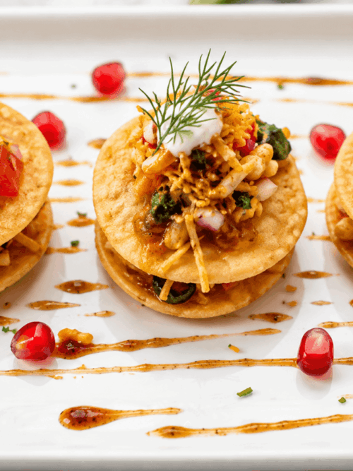 Fine dining bhel puri recipe with crispy puri tamarind chutney yogurt and pomegranate