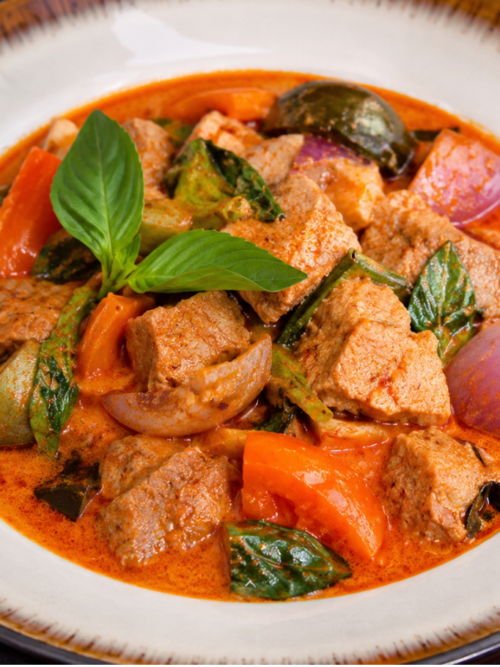Thai red curry recipe with pork, vegetables and Thai basil