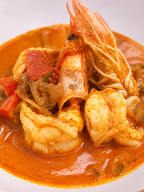 Kerala style prawn curry served in coconut milk sauce