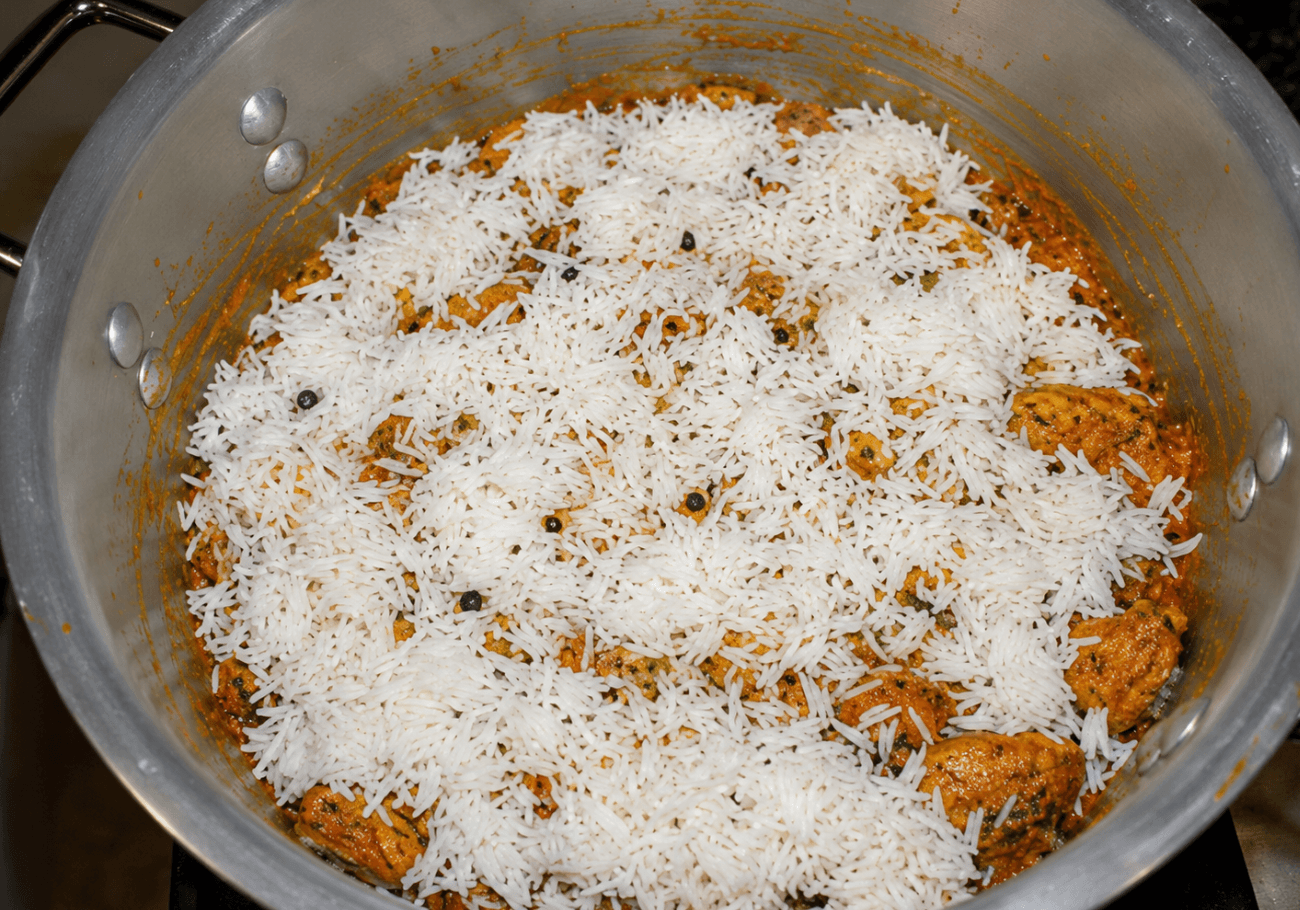 Basmati rice layered over marinated lamb for nalli biryani recipe