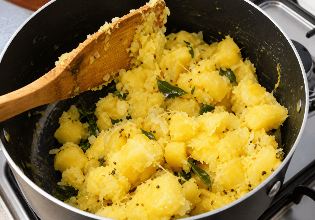 Kerala tapioca recipe with curry leaves mustard seeds and spices