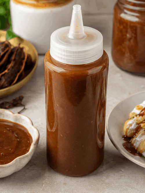 Tamarind chutney for chaat served in a bowl with Indian snacks