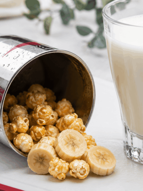 Banana milkshake recipe with popcorn served in a glass