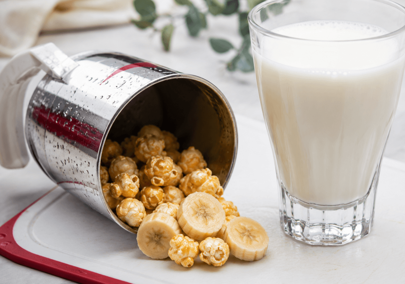 Banana milkshake recipe with popcorn served in a glass
